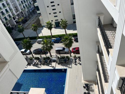 an overhead view of a swimming pool in a building at Coastline Luxury Apart Hotel in Golem