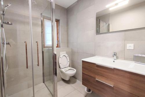 a bathroom with a toilet and a sink and a shower at CHALET LUMI - Chalet CHALET LAURENTIDE pour 6 Personnes 464 in Les Avanchers
