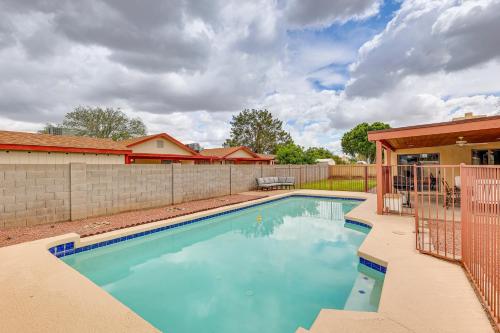a swimming pool in front of a house at Private Pool and Patio Home Near Mesa Arts Center! in Mesa