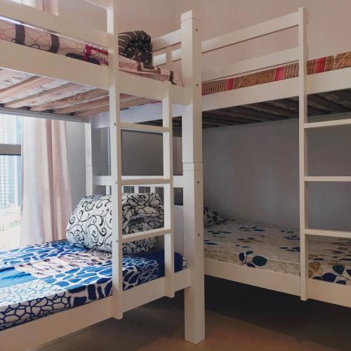 a bunk bed room with two bunk beds in it at Sea la Vie in Dubai