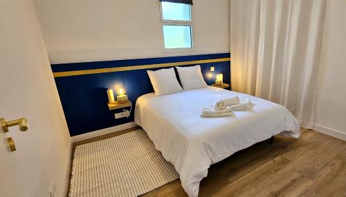 Ένα ή περισσότερα κρεβάτια σε δωμάτιο στο Appartement Le Porto