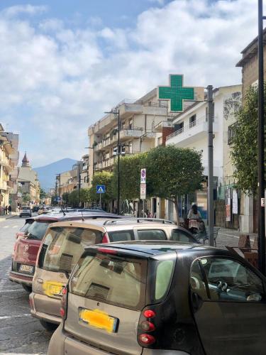 a row of cars parked on the side of a street at b&b Santa Maria in Santa Maria a Vico