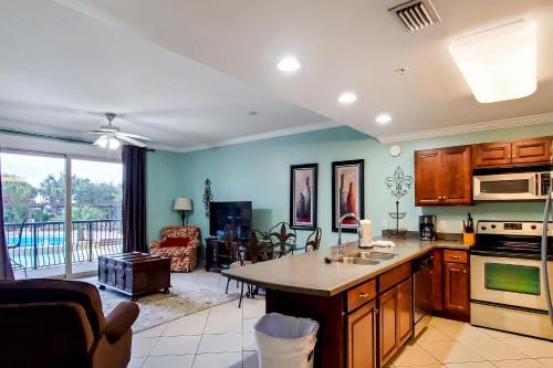 a kitchen with a kitchen island in a living room at Beach Resort 210 in Destin