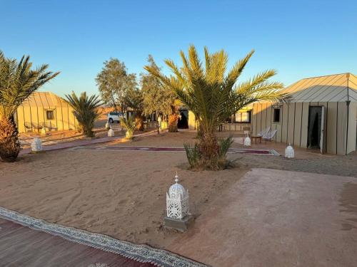 a fire hydrant sitting in the middle of a yard at Erg Chebbi Sahara Camp in Merzouga