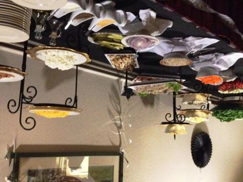 a ceiling with many plates and bowls on it at Hilton Garden Inn Nanuet in Nanuet