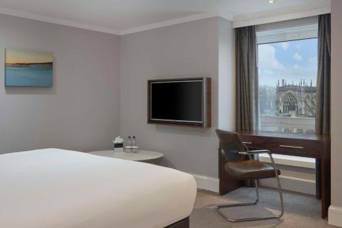 a hotel room with a bed and a television at DoubleTree by Hilton Bristol City Centre in Bristol