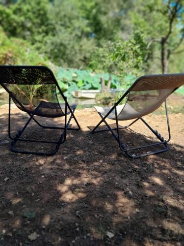 two chairs sitting next to each other on the ground at Domaine d'Avalon in Lorgues
