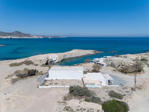 an aerial view of a house and the ocean at Mytakas Houses in Mytakas
