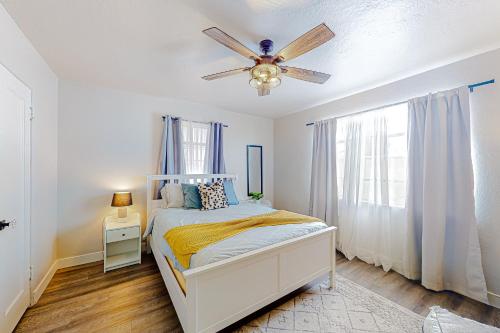 a bedroom with a bed and a ceiling fan at Make Mine Mesa - Unit A in Mesa