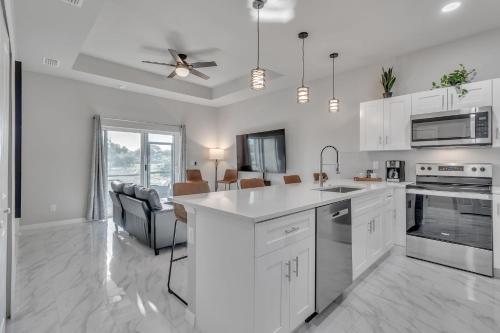 a kitchen with white cabinets and a white counter top at Three-Bedroom House in Lehigh Acres