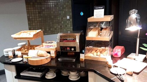 a counter with many boxes of food on it at Orida Hotels Newbury in Newbury