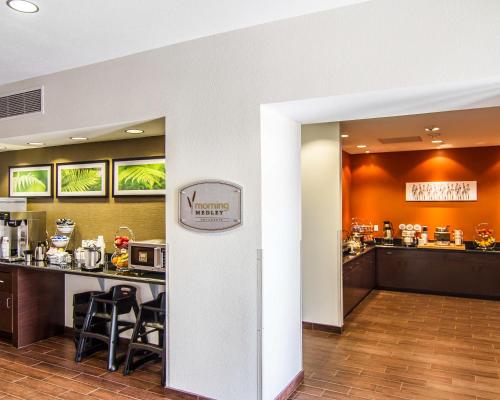 a lobby of a hotel with a bar and a restaurant at Sleep Inn Lufkin in Lufkin
