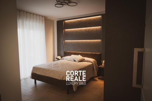 a bedroom with a bed and a window at CORTE REALE Luxury B&B in San Salvo