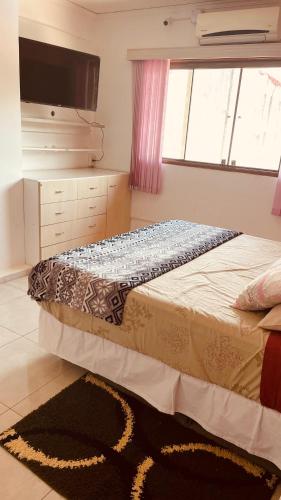 Katil atau katil-katil dalam bilik di Casa Hotel Confortable