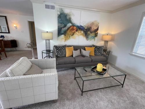 a living room with a couch and a table at The Terrace Room @ Galleria in Houston