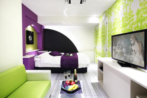 Ένα ή περισσότερα κρεβάτια σε δωμάτιο στο Hotel L'eclair (Adult Only)