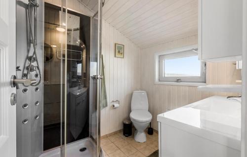 a bathroom with a shower and a toilet and a sink at 3 Bedroom Amazing Home In Bogense in Bogense