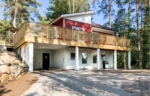 a house with a balcony on top of it at Amazing Home In Sjöbo With Wifi in Sjöbo
