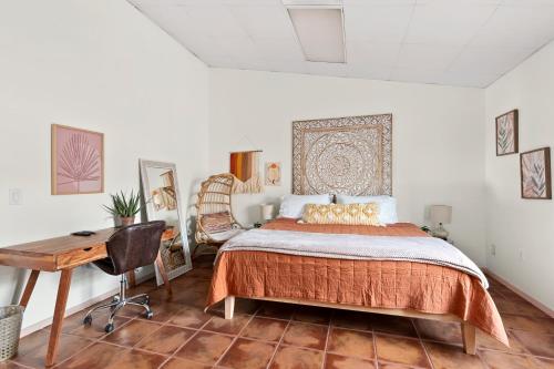a bedroom with a bed and a desk at Spacious House in Roundrock in Round Rock