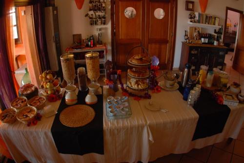 a table with food on it in a kitchen at Li Espi Country Resort in Porto Pollo