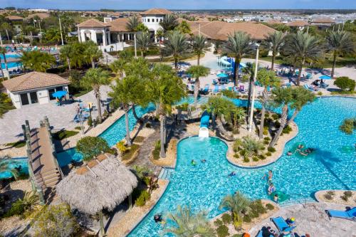 an aerial view of a pool at a resort at 1056 LS - Luxury 4BR3BA - Champions Gate Bliss in Kissimmee