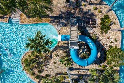 an overhead view of a swimming pool at a resort at 1056 LS - Luxury 4BR3BA - Champions Gate Bliss in Kissimmee