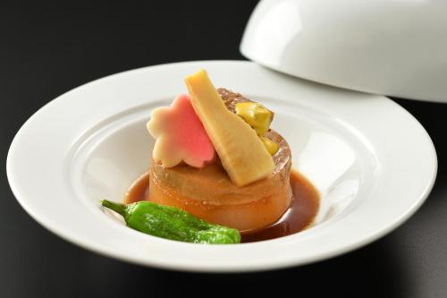 a white plate with a dessert on a table at Kami no yama Azumaya in Kaminoyama