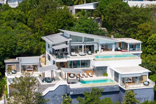 an aerial view of a house with a swimming pool at Karpe Diem Villa - Twin Infinity Pools in Chaweng Noi Beach