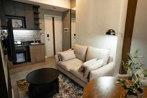 a living room with a couch and a table at Amber Hotel - Cebu in Cebu City