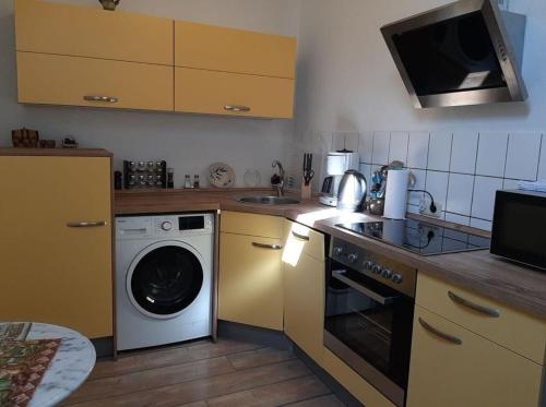 A kitchen or kitchenette at Appartement in Gehren
