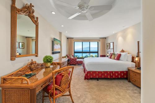 a hotel room with a bed and a desk and a bedroom at Kaanapali Alii 4104 in Kaanapali