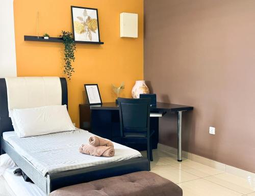 a room with a desk and a bed and a table and chair at Manhattan Austin By JC Home in Johor Bahru