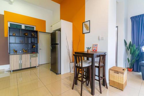a kitchen with a table and a refrigerator at Manhattan Austin By JC Home in Johor Bahru
