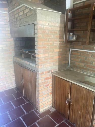 a brick oven in a kitchen with a brick wall at Parada y relax en Alvorada, Barra do Chui in Chuí