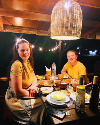 a man and a woman sitting at a table at Bissa Villa in Habarana