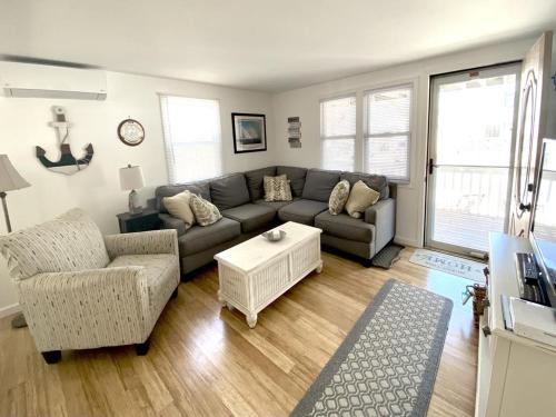 a living room with a couch and a table at Lbi Vacation Rental Property in Beach Haven