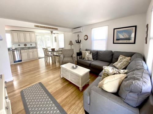 a living room with a couch and a table at Lbi Vacation Rental Property in Beach Haven