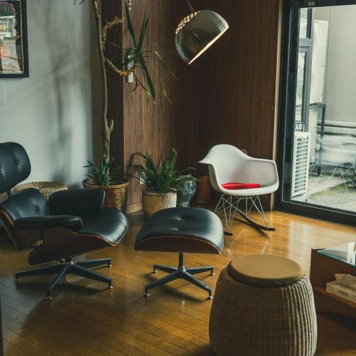 a room with a bunch of chairs and chairs at TSURUOKA GINZA 朙 sukima in Tsuruoka