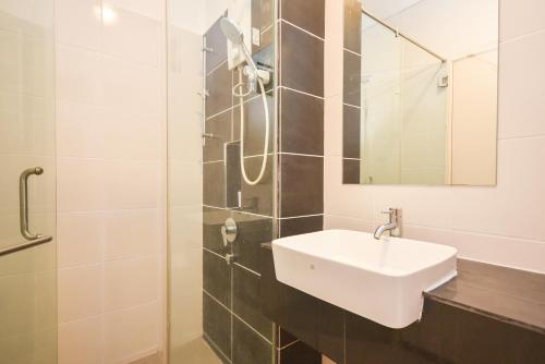 a bathroom with a sink and a shower at 1Medini Theme Suite by Nest Home【LEGOLAND】 in Nusajaya