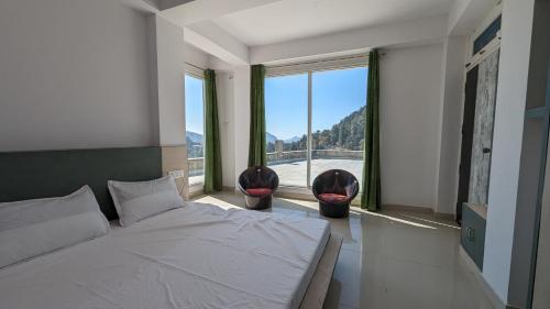 Postel nebo postele na pokoji v ubytování El Cielo, B&B