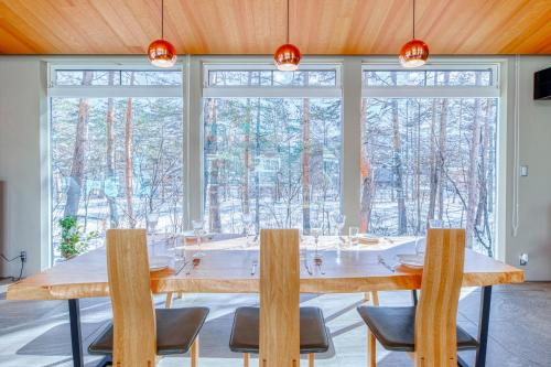 a large dining room with a large table and chairs at Hakuba Jade Chalet by Jade Group in Hakuba