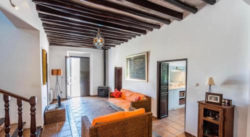 a living room with a couch and a table at Cortijo Andaluz Doña Adela in Almería