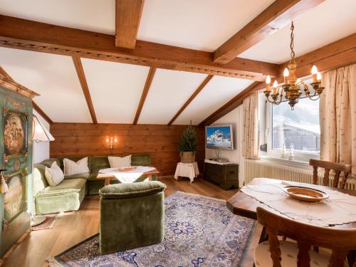 a living room with a couch and a table at Ferienwohnung Wallner in Zell am Ziller