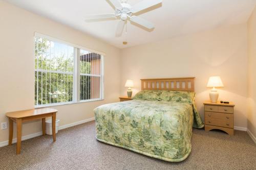 a bedroom with a bed and a window at Kosies Lake Escape in Orlando