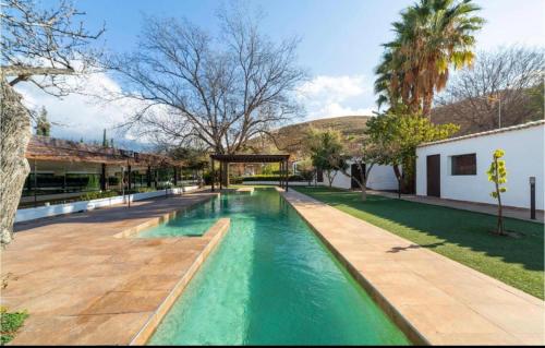 a swimming pool in the middle of a yard at Cortijo Andaluz Doña Adela in Almería