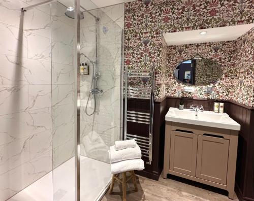 a bathroom with a shower and a sink at The Three Tuns in Chepstow