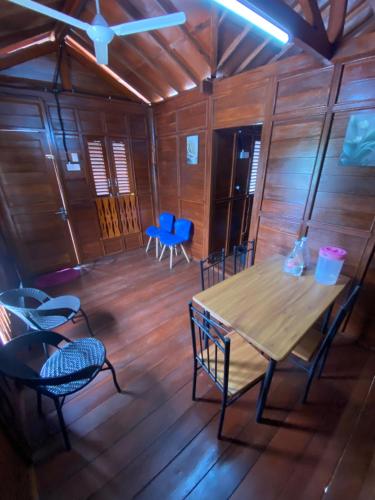 a dining room with a table and chairs at HOMESTAY KAYU in Kajang