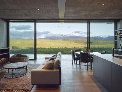 a living room with a couch and a table at Bunker House in Lake Tekapo