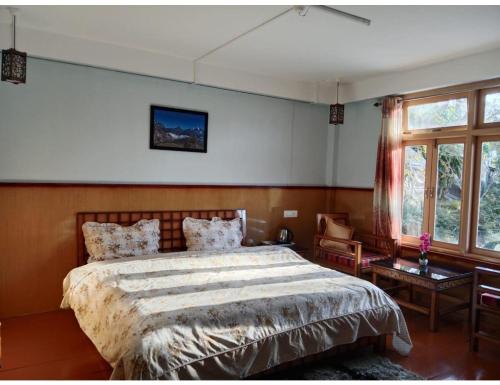 Postel nebo postele na pokoji v ubytování Tashi Homestay,Arunachal Pradesh