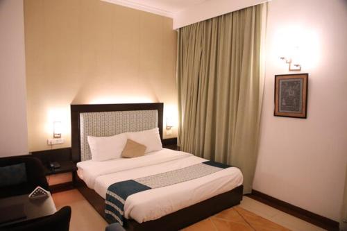 Postel nebo postele na pokoji v ubytování Status Club Resort